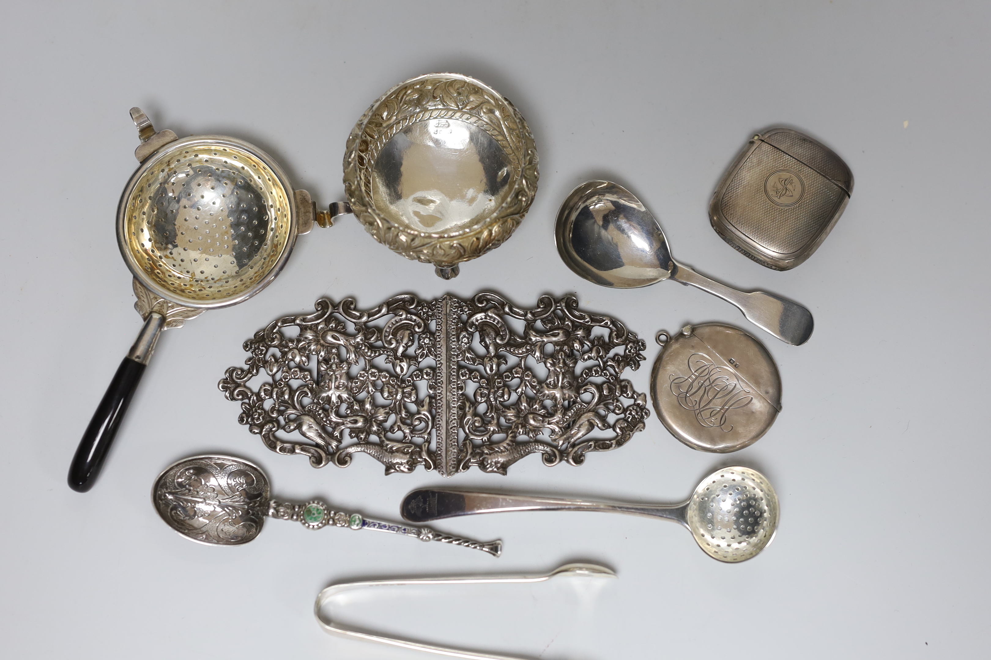 Sundry silver and white metal items including vesta cases, William IV caddy spoon, belt buckle, enamelled replica of the anointing spoon, etc.